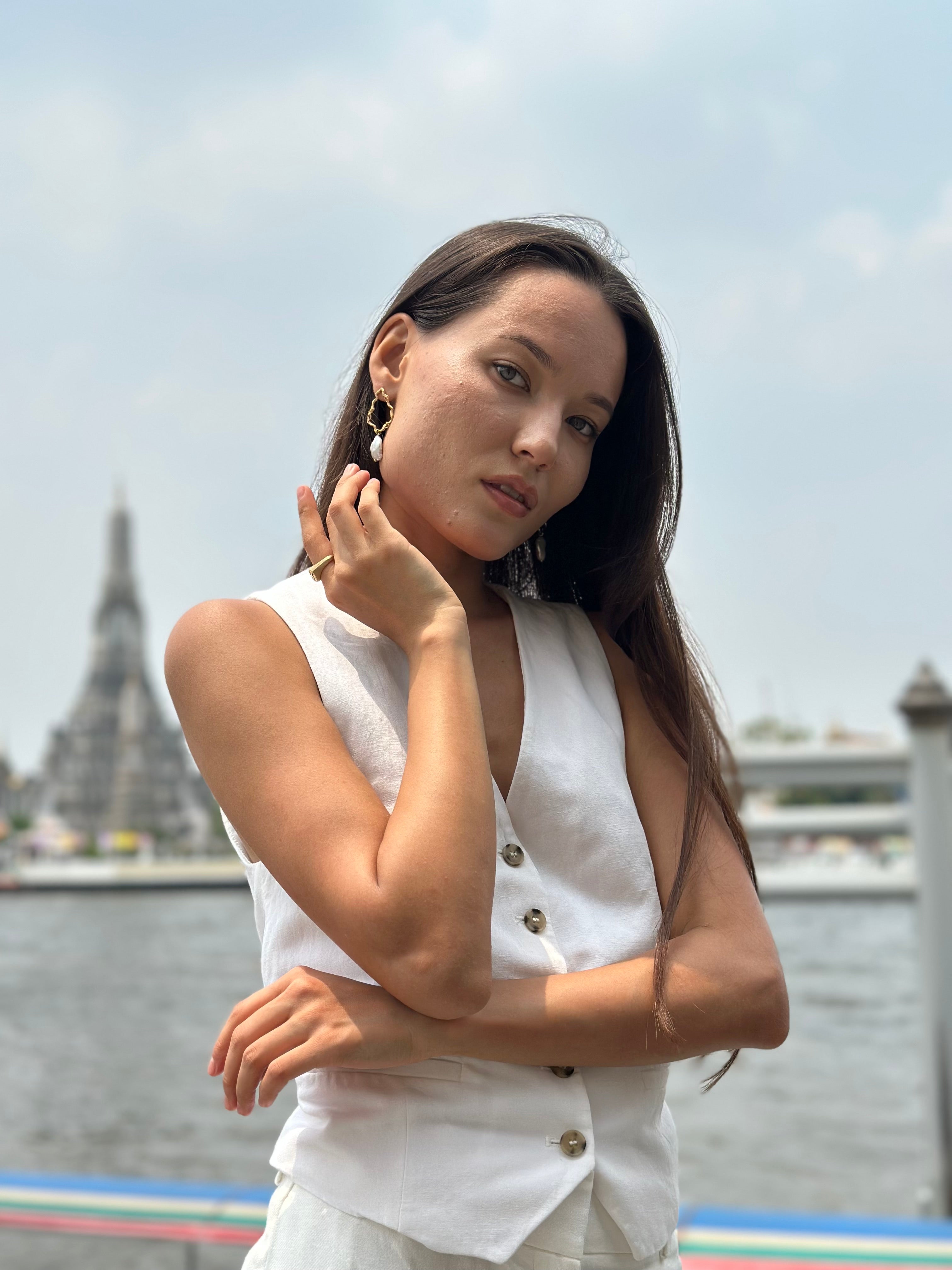 April wears statement gold pearl earrings in Thailand