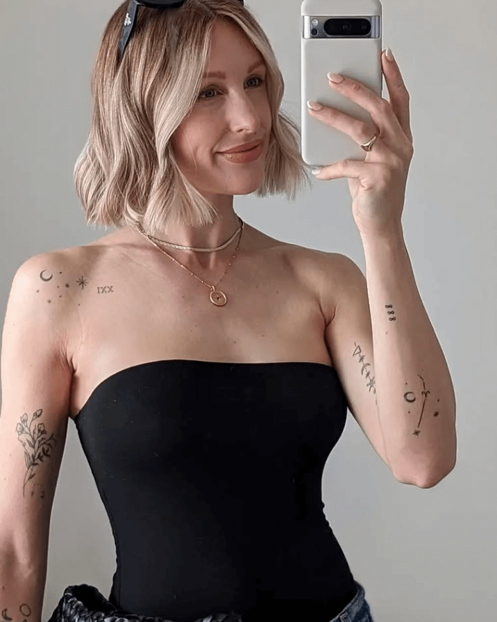 Charlotte Buttrick wears shorthand coin necklace