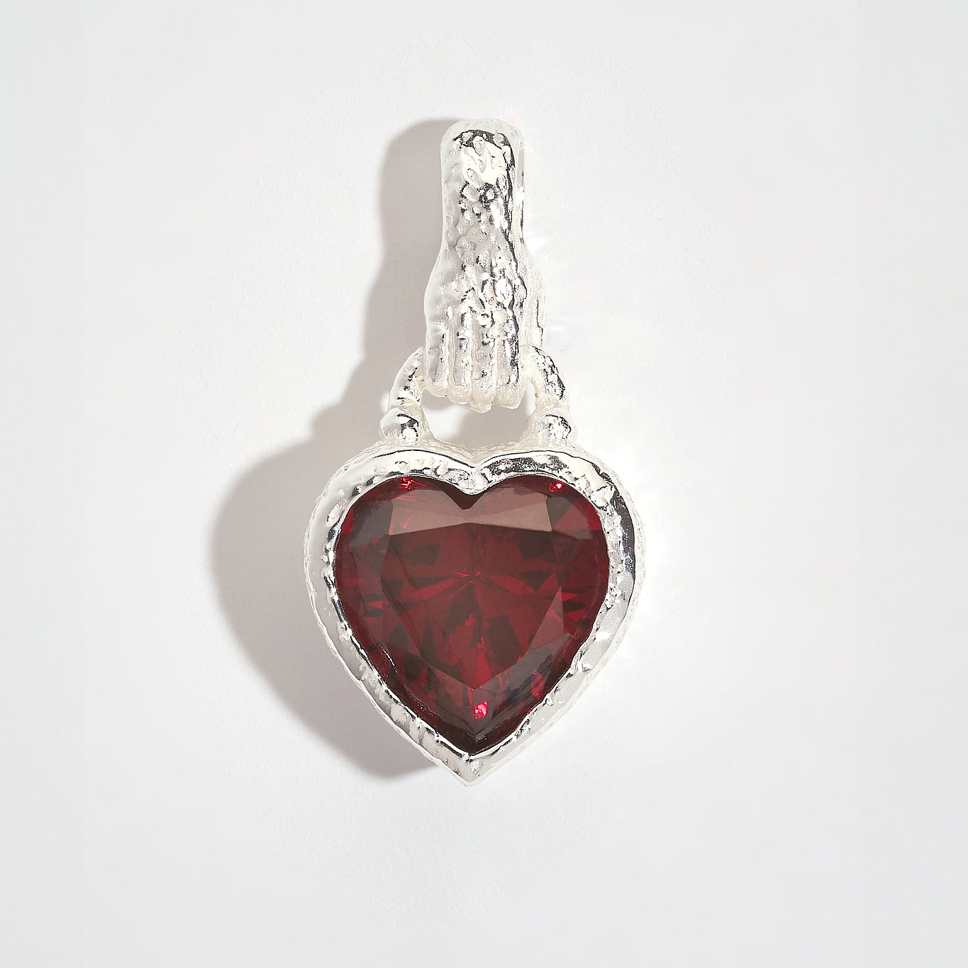 Garnet Heart in Hand Silver Charm Pendant