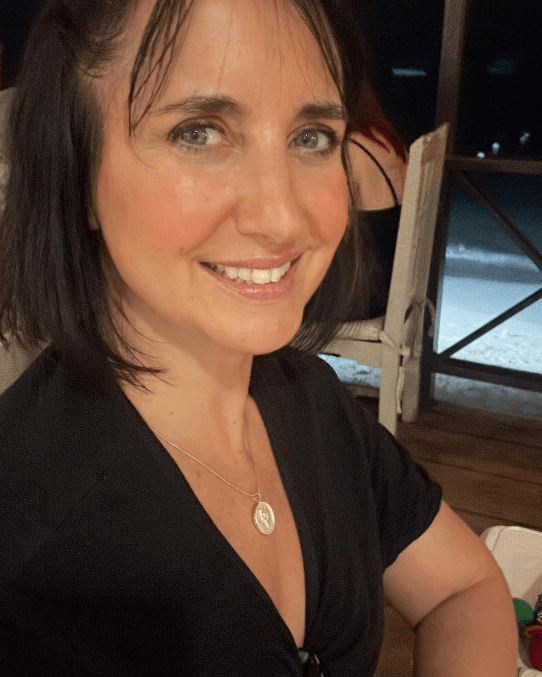 Lucy Owen wears shorthand necklace