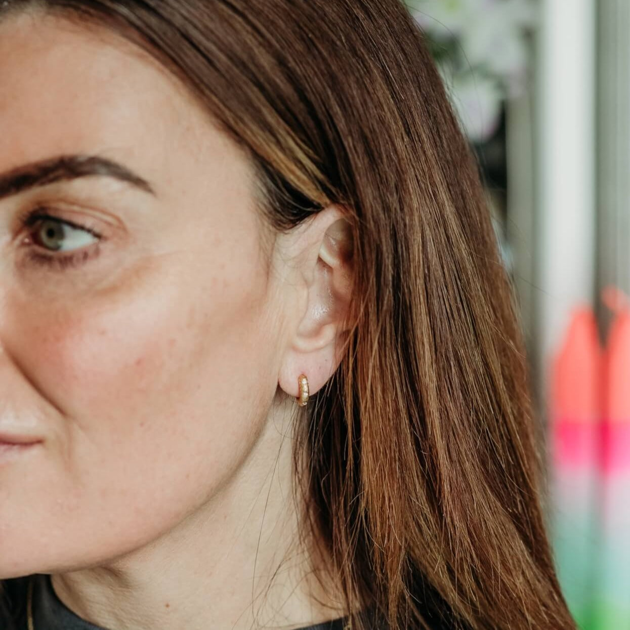 model wears  Lab grown diamond and 14k gold vermeil art deco huggie hoop earrings