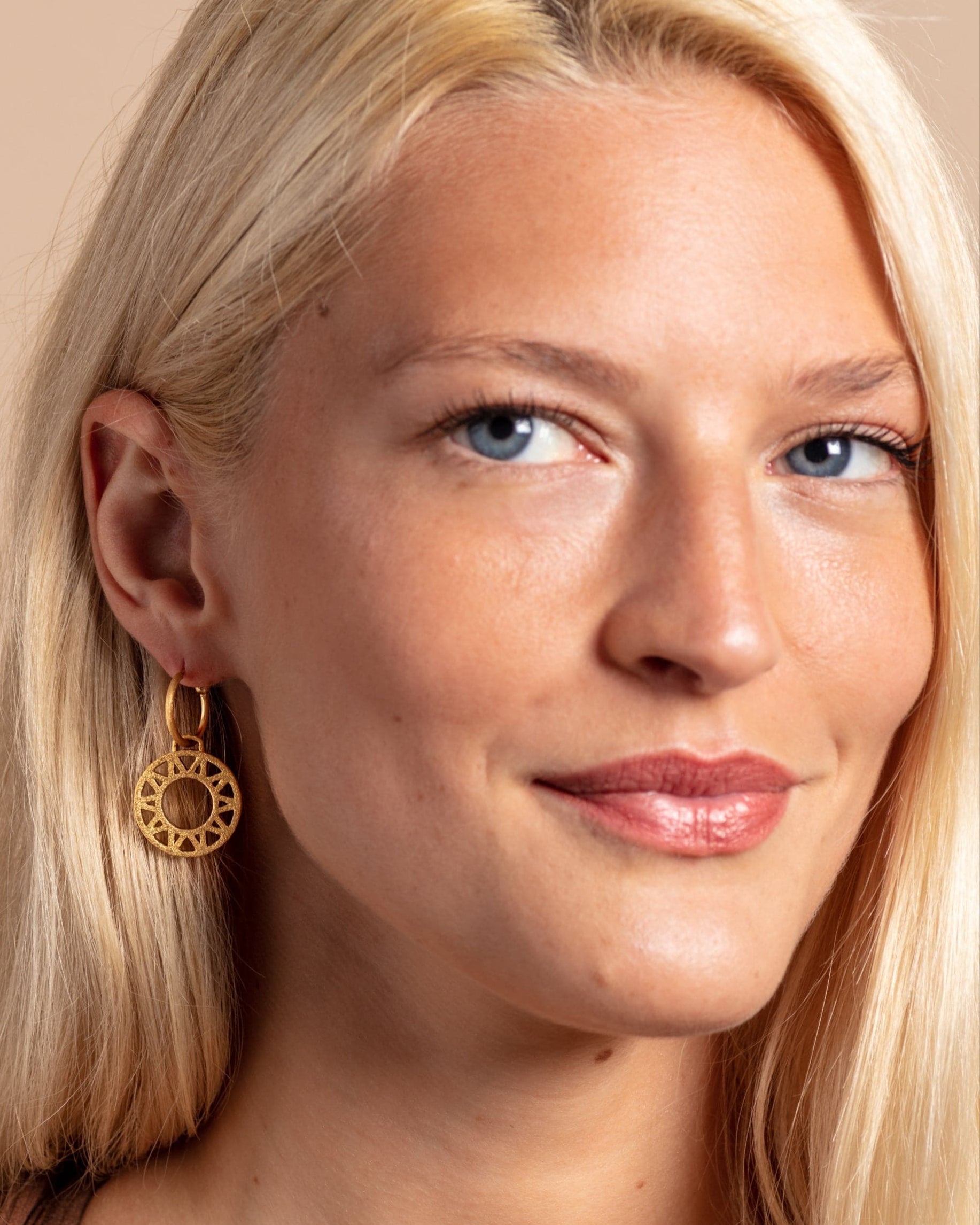model wears Geometric Statement Gold Hoop Earrings