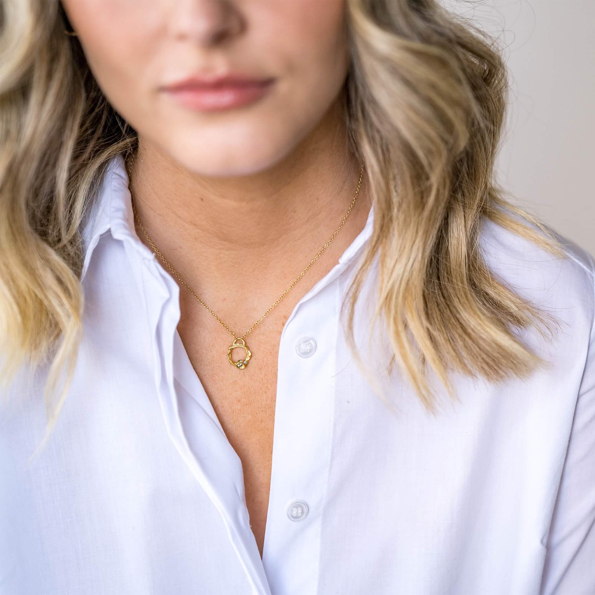 model-wears-18k-gold-vermeil-aquamarine-brirthstone-small-branch-eternity-necklaceclaire-hill-designs