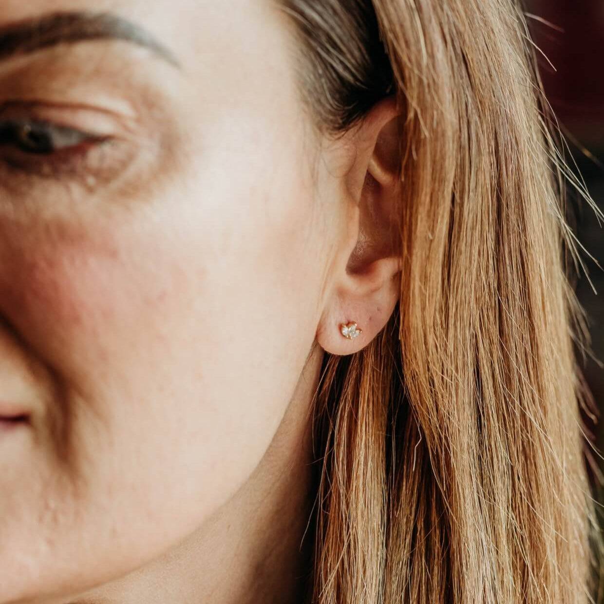 model wears Sparkly Marquise Fan Gold Stud Earrings