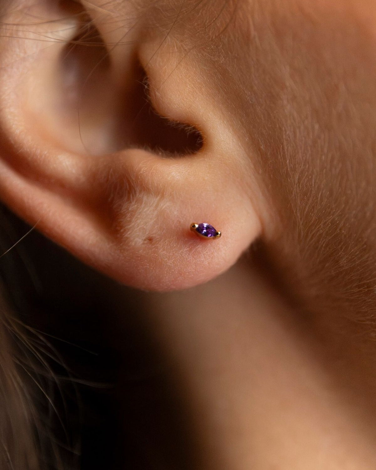 model wears Amethyst Cubic Zirconia Gold Labret Earring