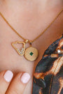 model-wears-gold-lovespoon-charm-and-sparkly-cloud-charm-necklace-