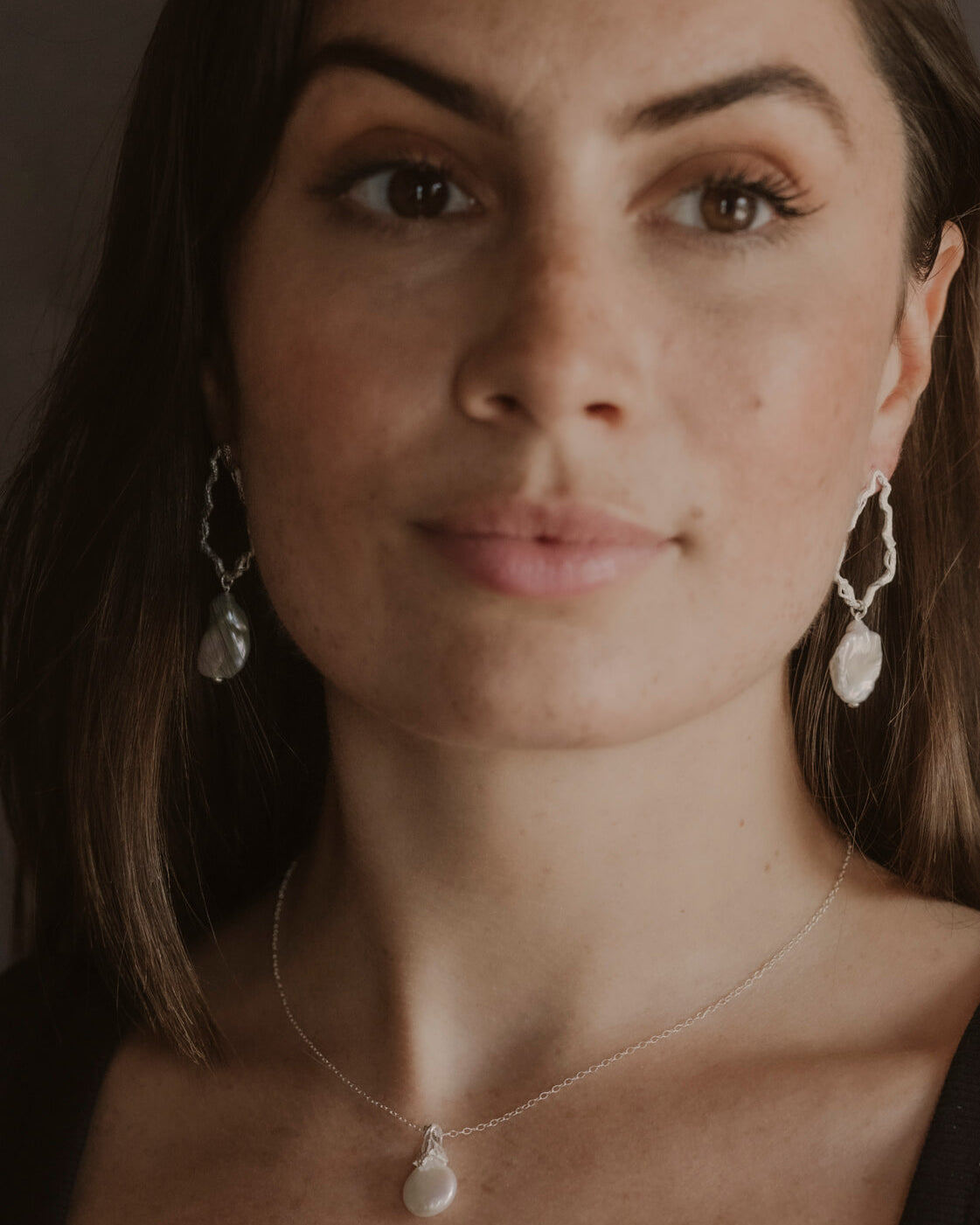 model wears Pearl Silver Lichen Pendant Necklace and pearl silver drop earrings