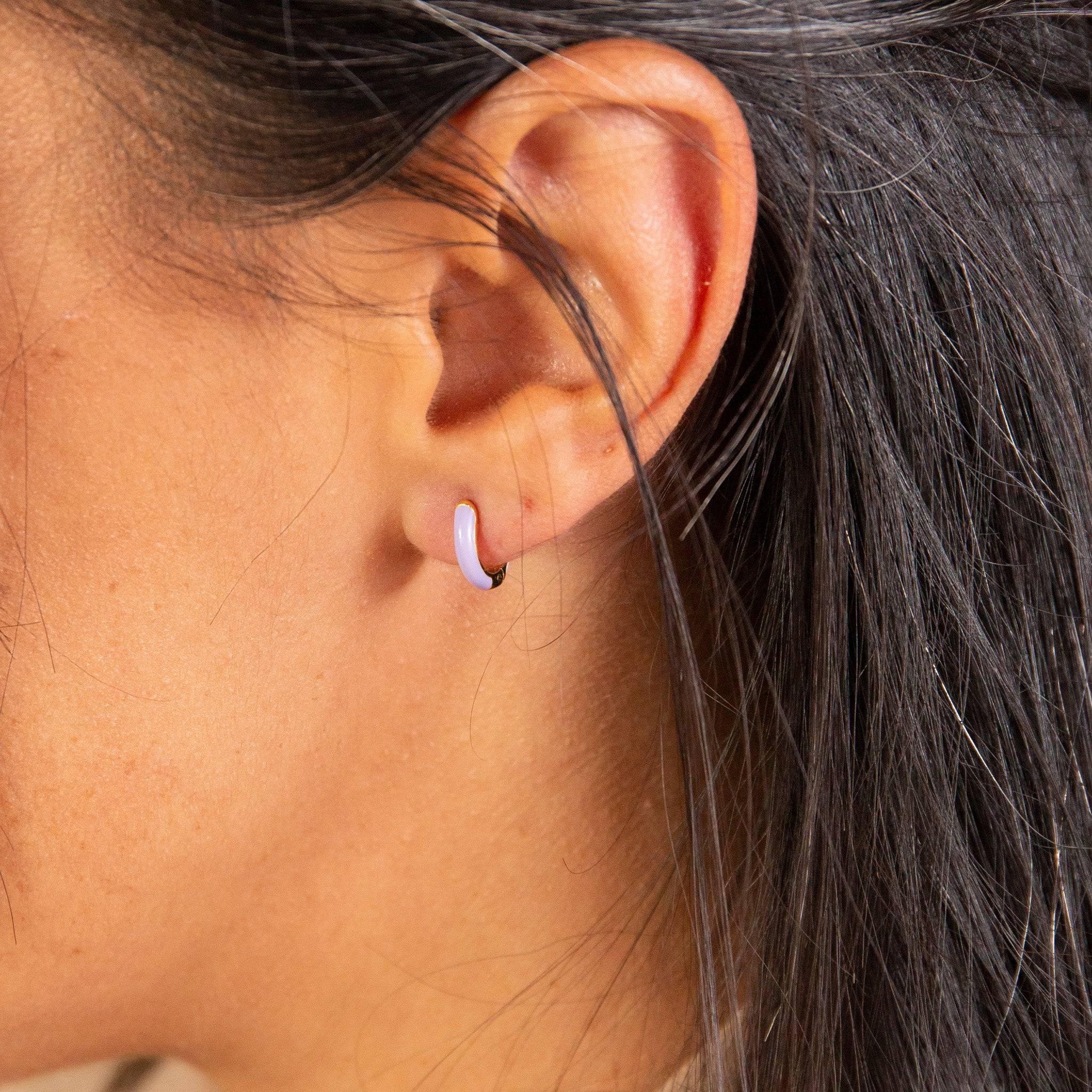 model wears Lavender Enamel Gold Huggie Earrings - close up