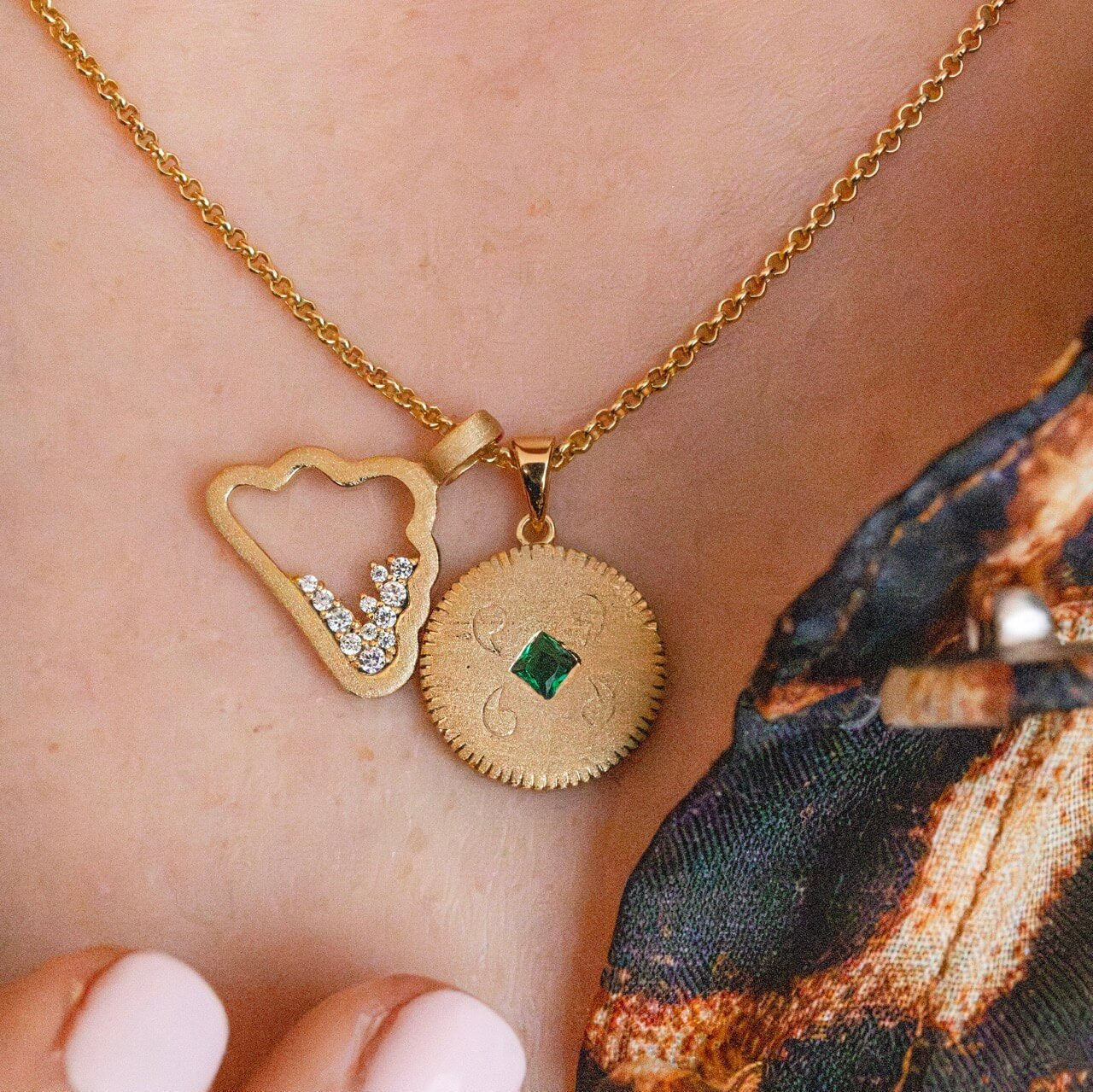 Model wears Lovespoon charm and cloud charm necklace