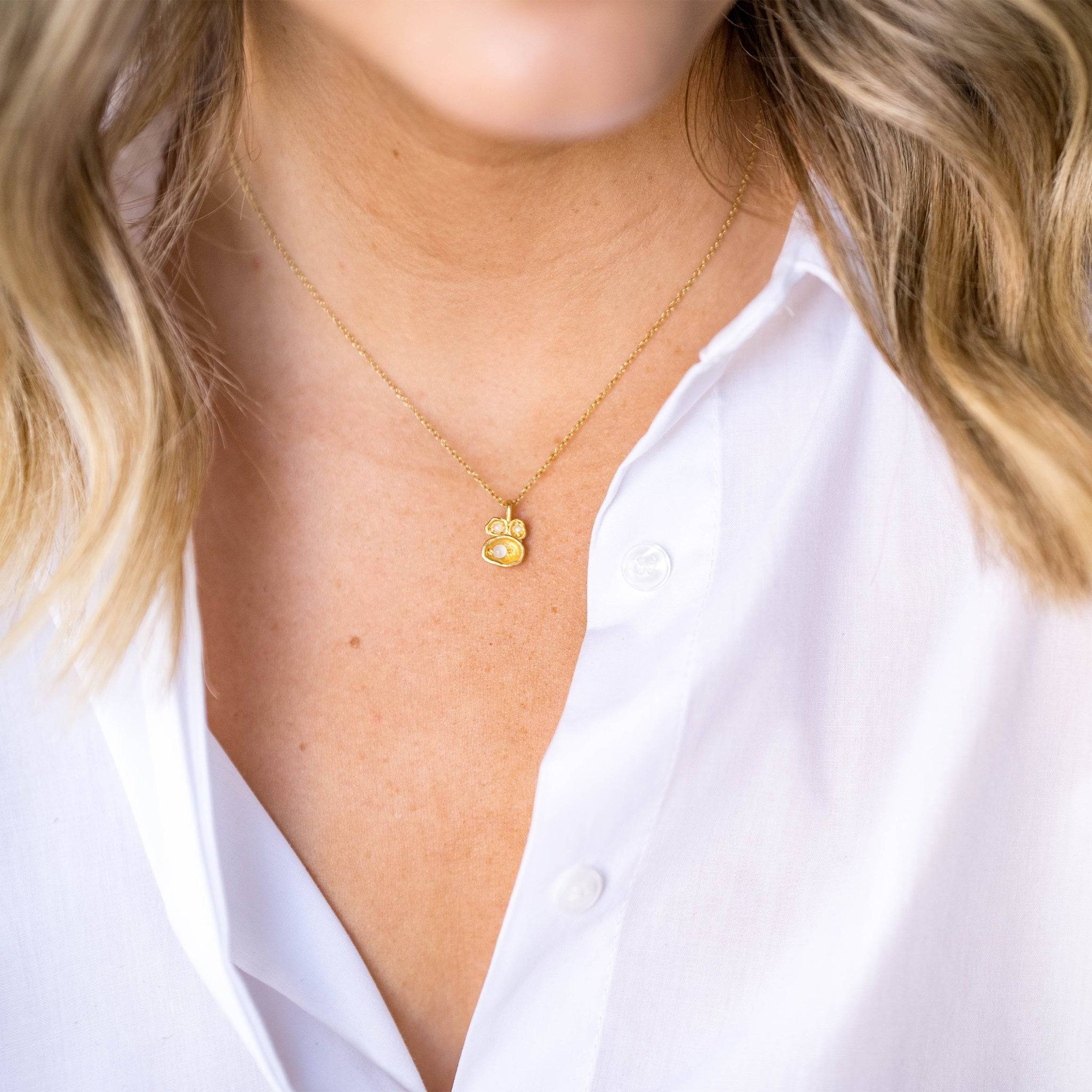 model wears Moonstone and Gold Lichen Pendant Necklace