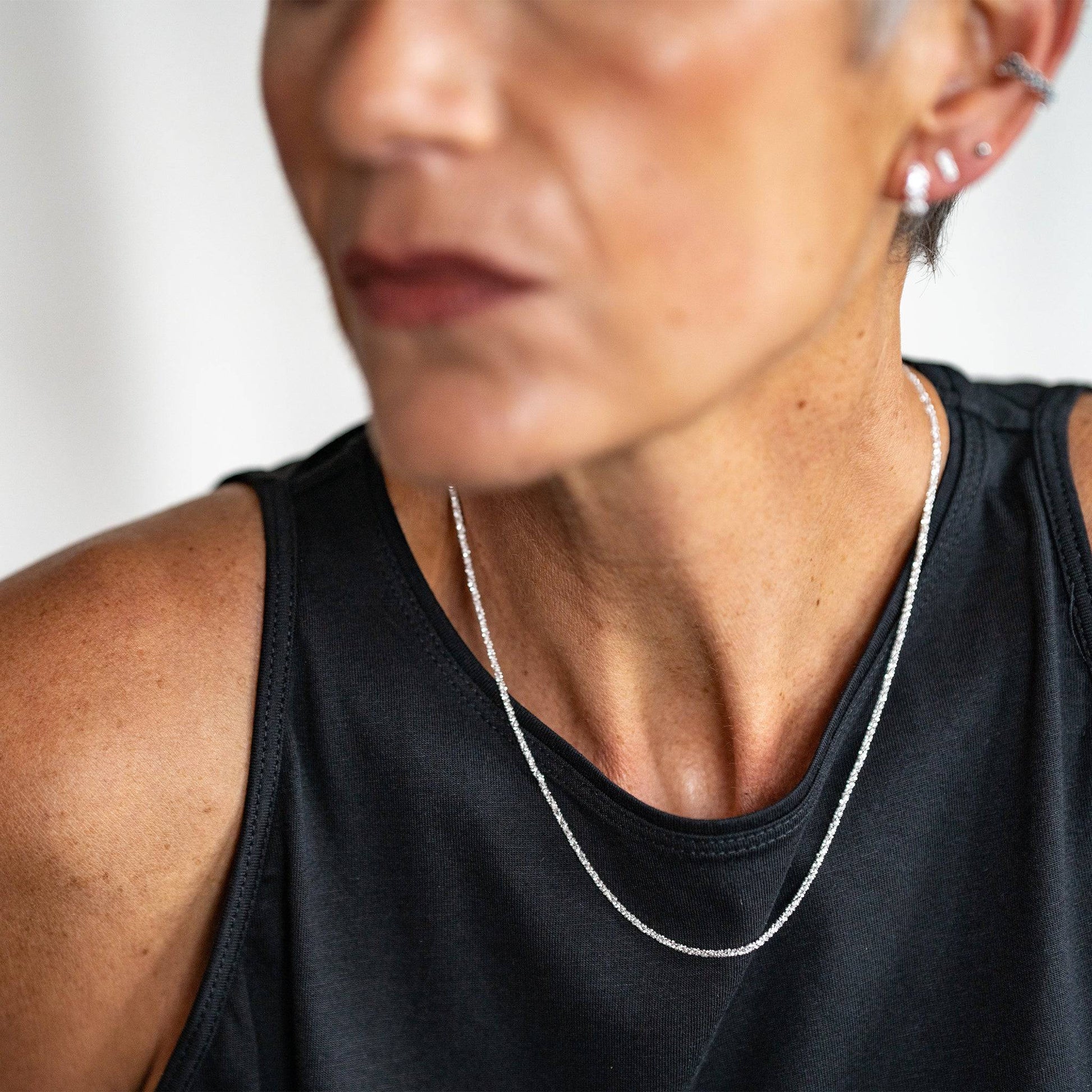 model wears silver stardust chain necklace