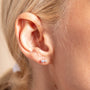 model wears Galaxy Sparkly Silver Stud Earrings close up
