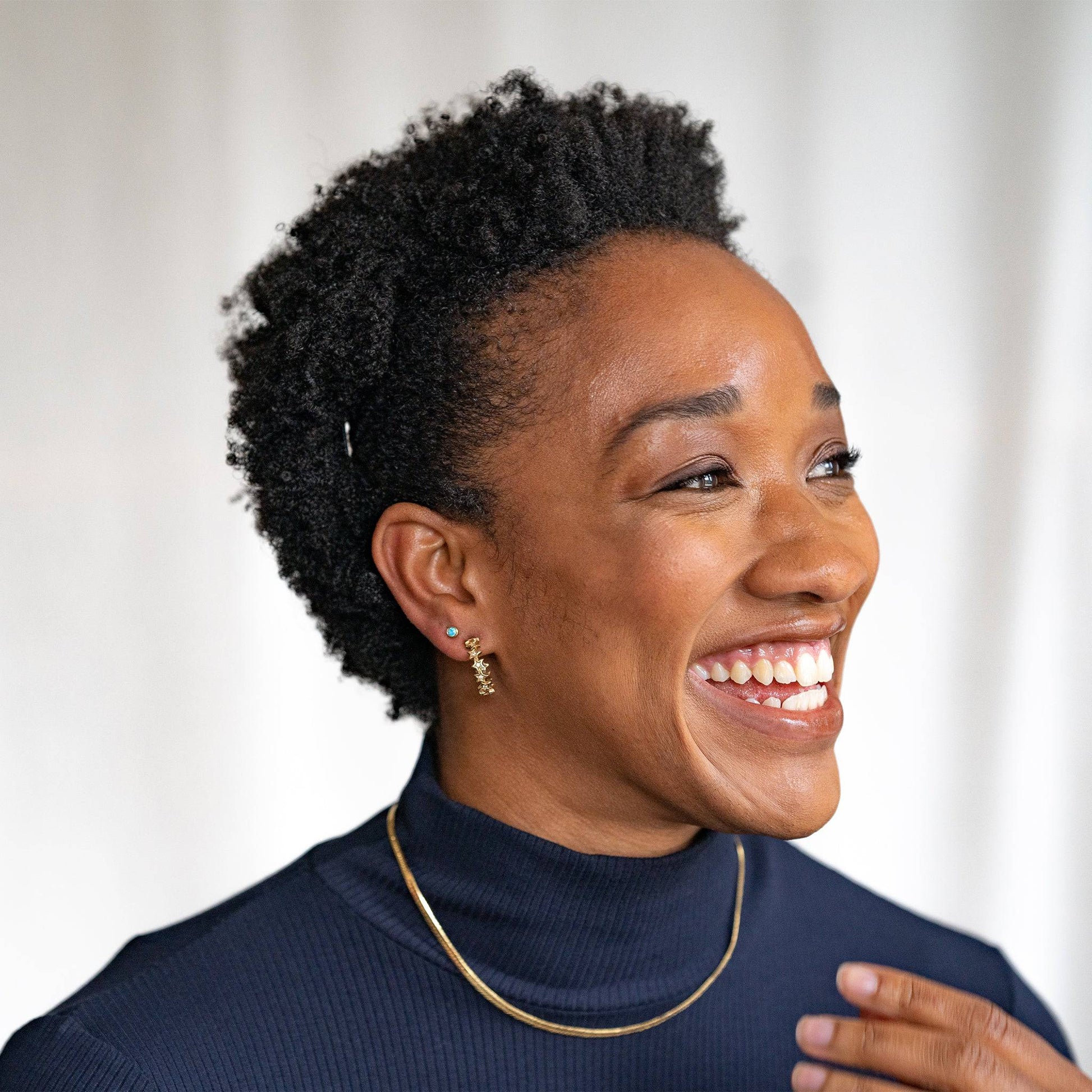 model wears Sparkly Star Statement Gold Hoop Earrings