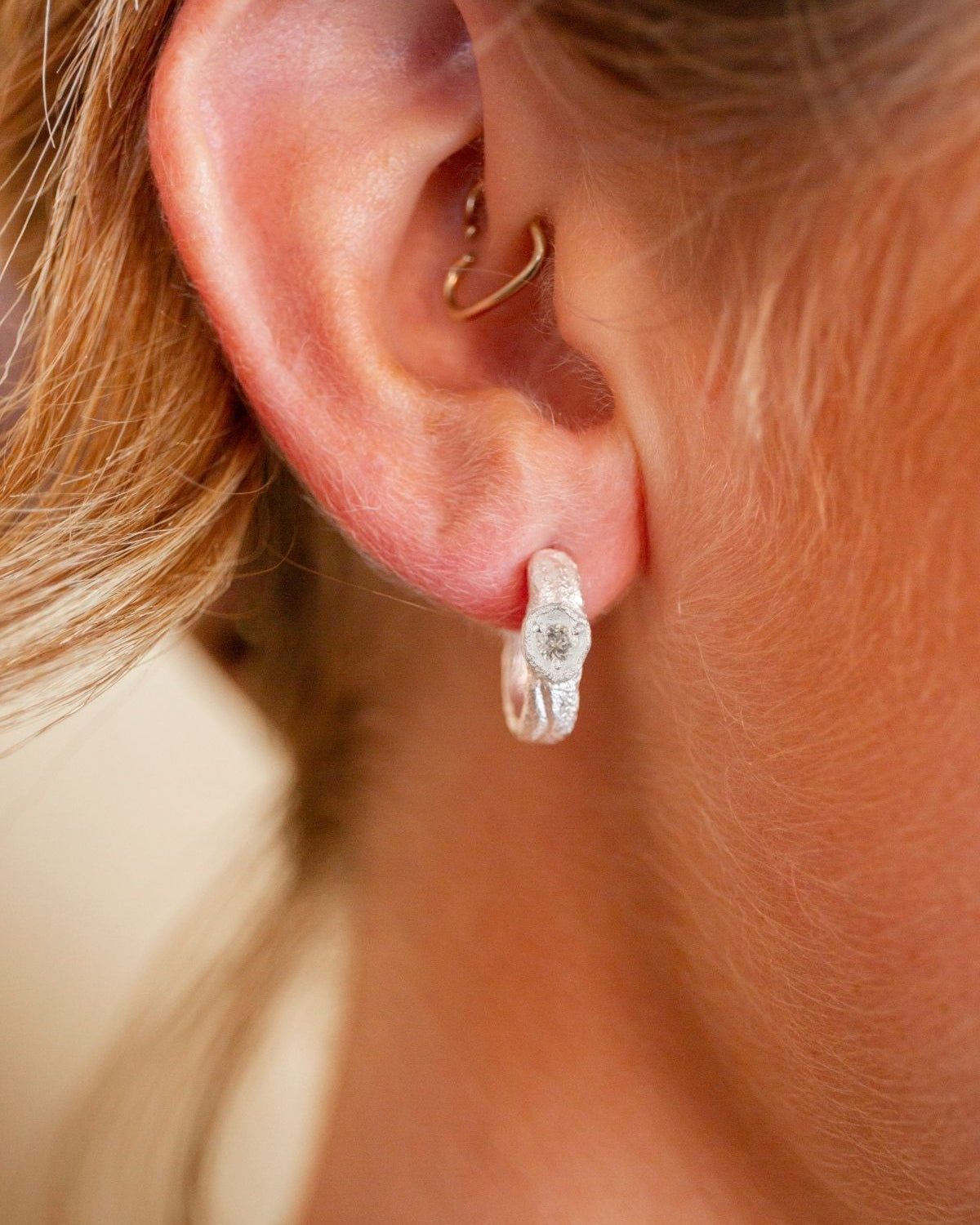 model wears White Topaz Silver Branch Hoop Earrings