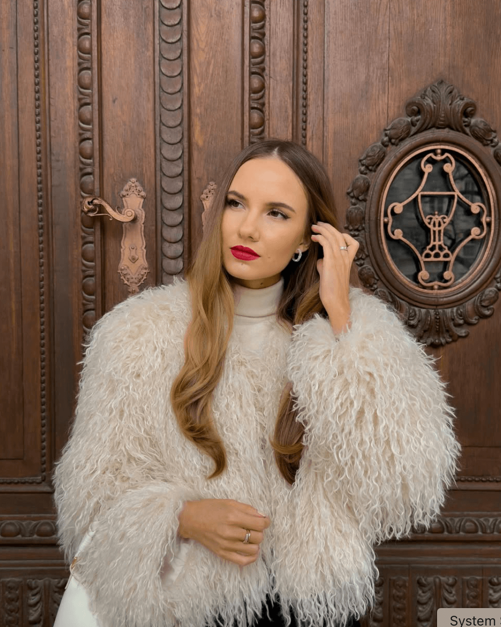 Rebeka Barath wears sparkly silver baguette hoop earrings