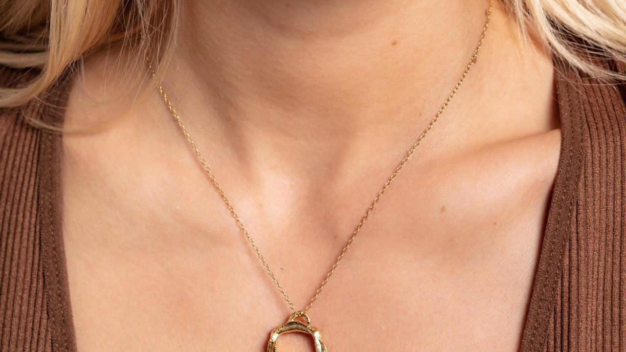 Model wears gold vermeil opal birthstone necklace