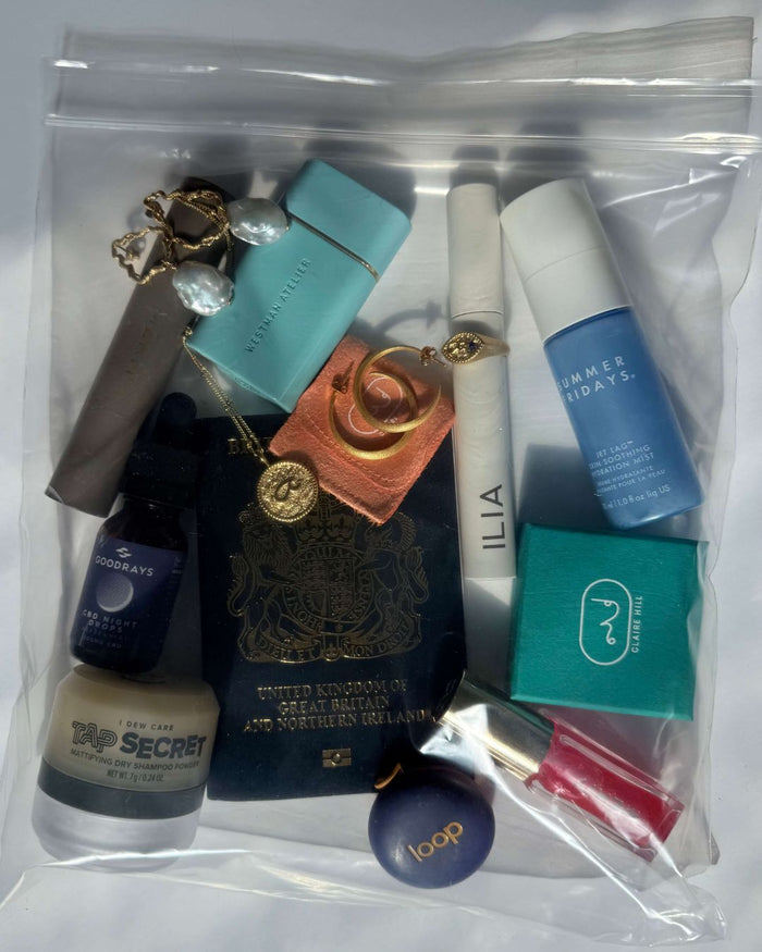 Clear plastic airplane carry on bag with jewellery, make up and essenntials 