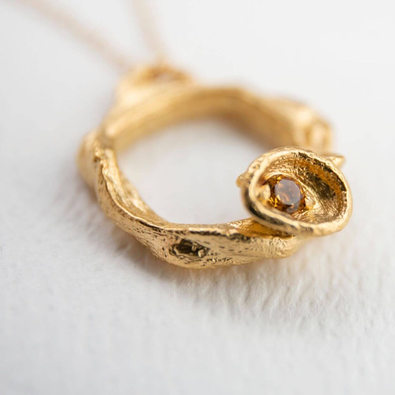 close up of 14k gold vermeil citrine gemstone birthstone large eternity necklace