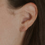 Model wears gold vermeil Fuck Shorthand Stud Earring