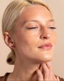 model wears 18k gold vermeil and black cubic zirconia mini stud earrings
