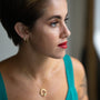 model wears Galaxy Sparkly Gold Scatter Huggie Hoop Earrings