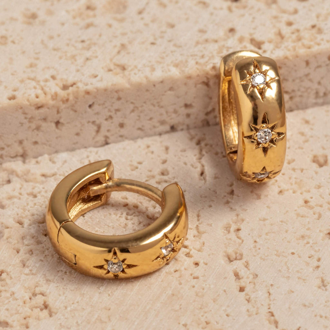 Sparkly Star Gold Huggie Hoop Earrings - close up