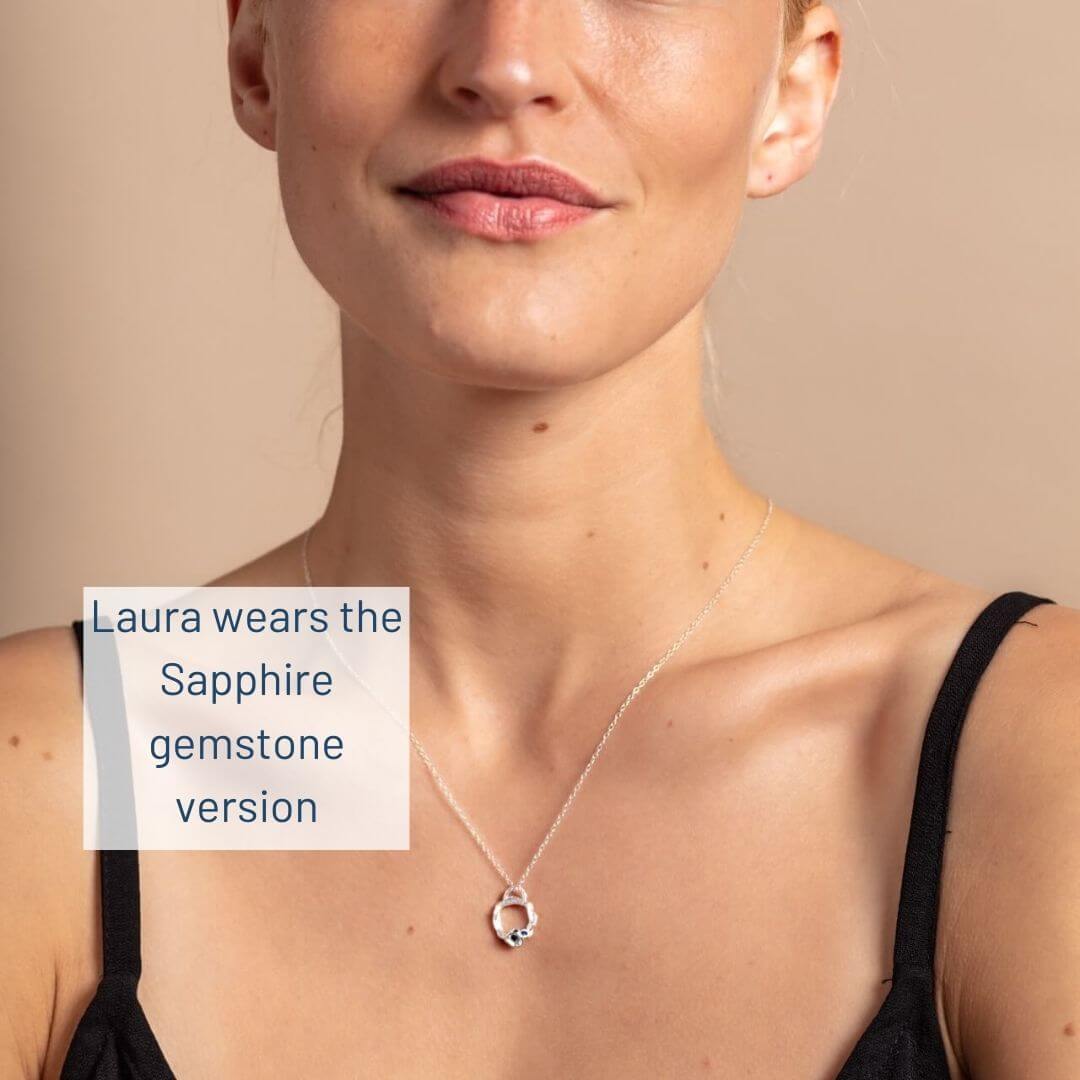 Laura wears silver sapphire version