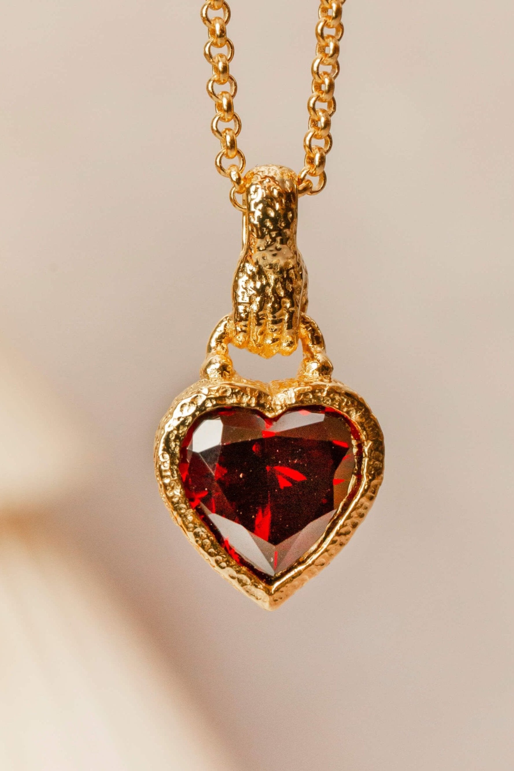 gold hand in heart charm necklace