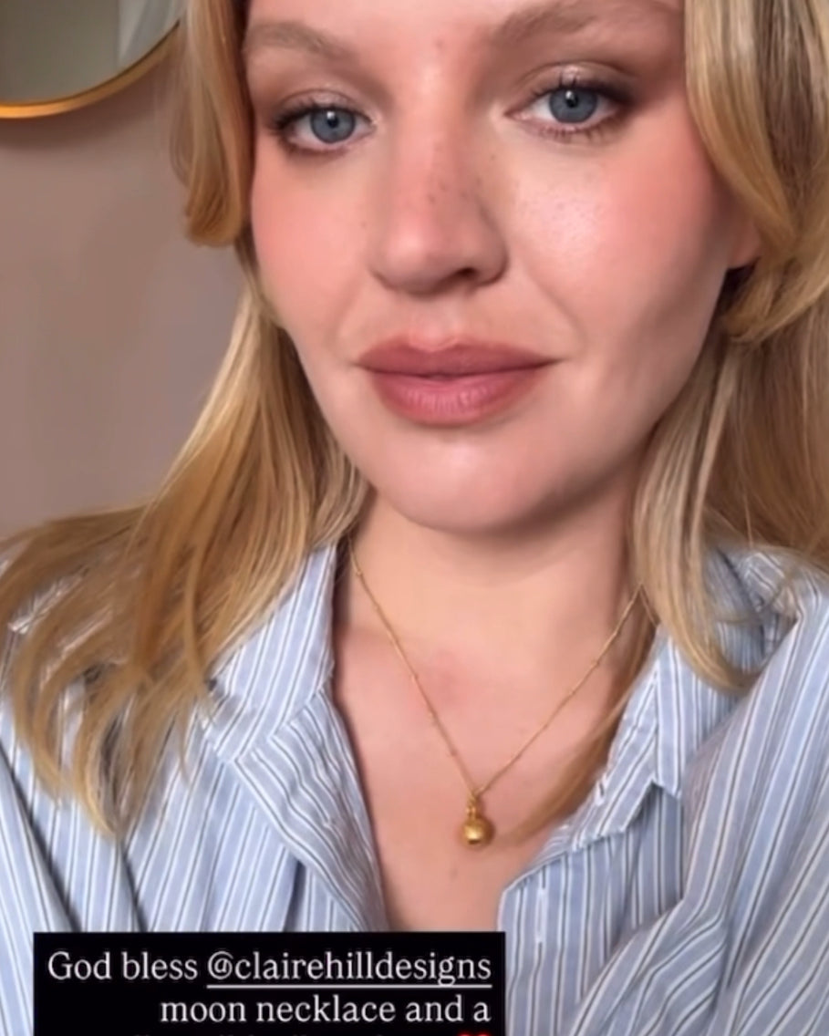 Singer Self Esteem in moon charm necklace