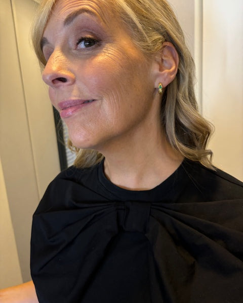Presenter Mel Giedroyc in emerald hoop earrings