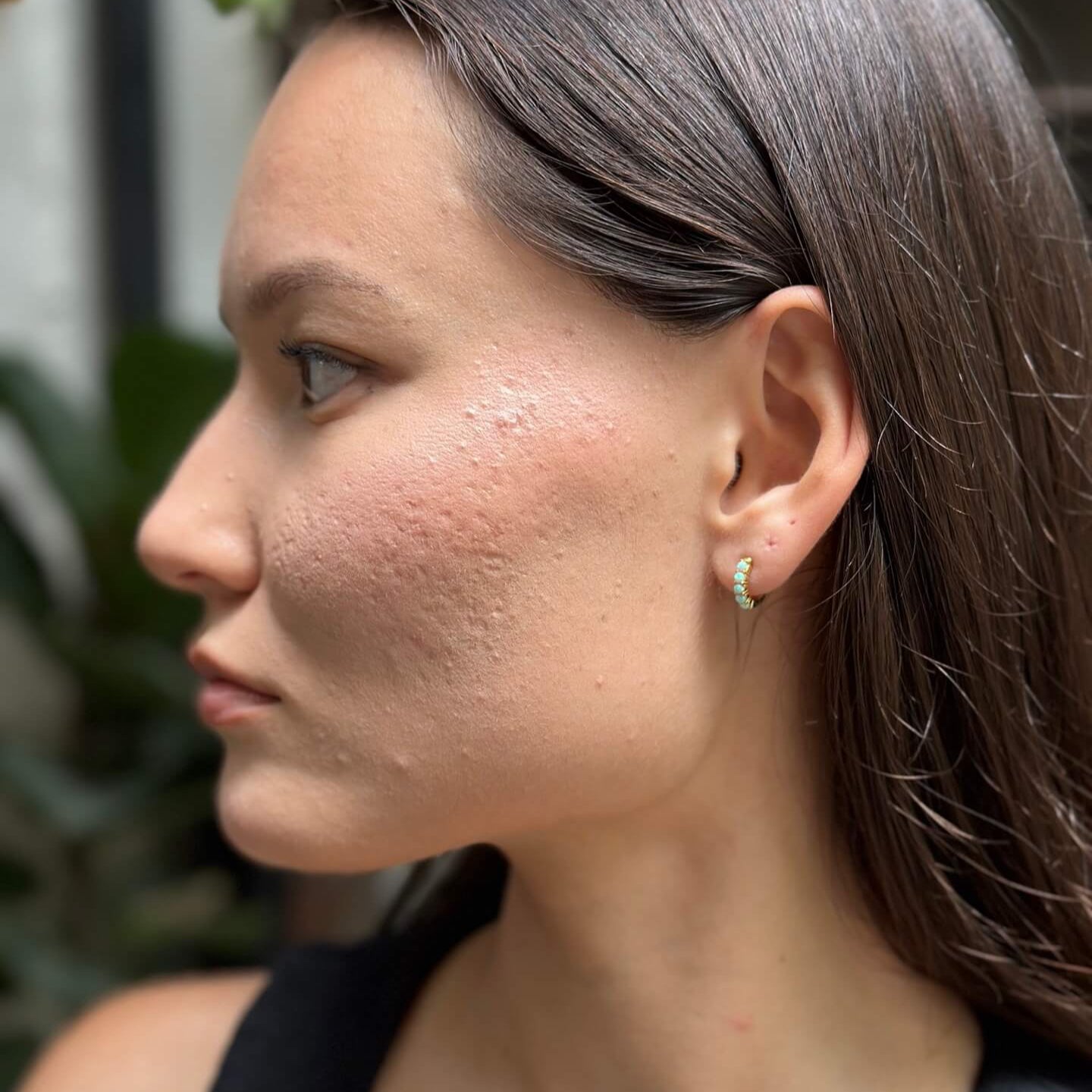model wears Moon Yellow Opal Gold Huggie Earrings