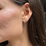model wears Moon Yellow Opal Gold Huggie Earrings