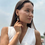 model wears Pearl Gold Branch Drop Earrings