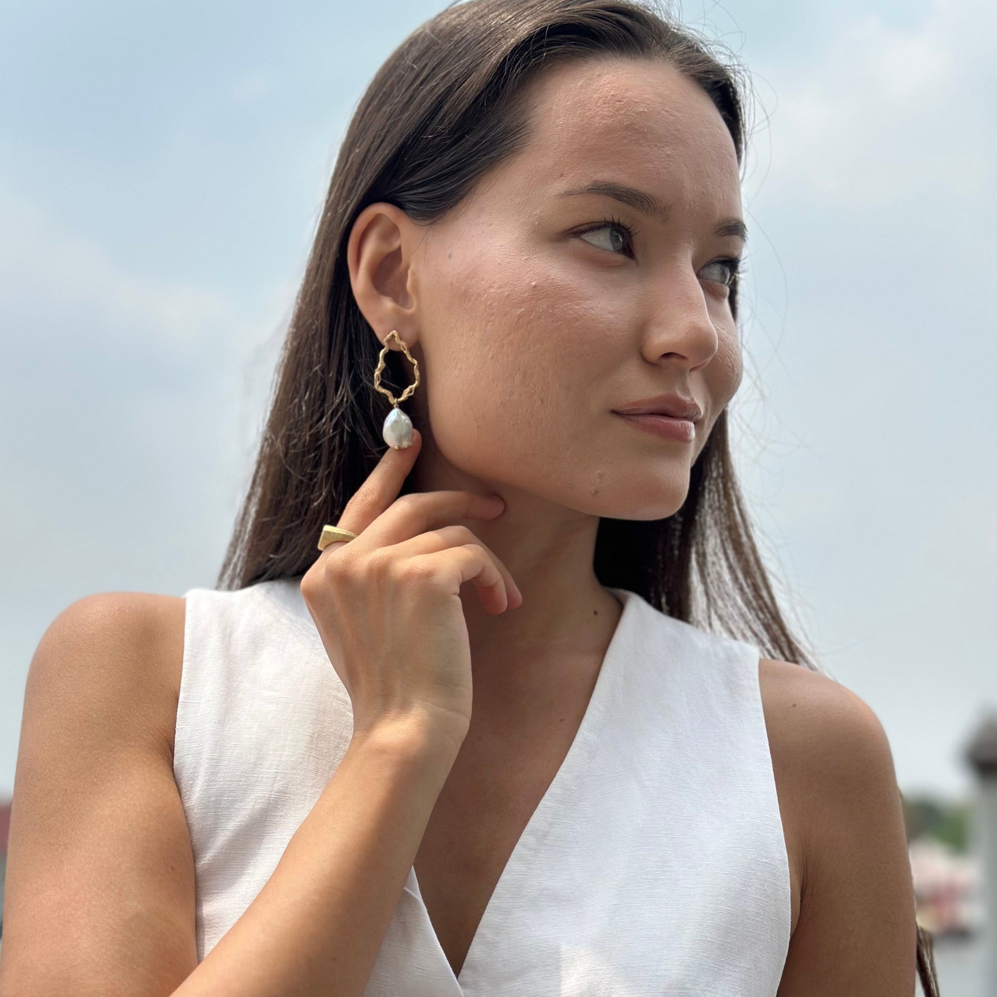 model wears Pearl Gold Branch Drop Earrings
