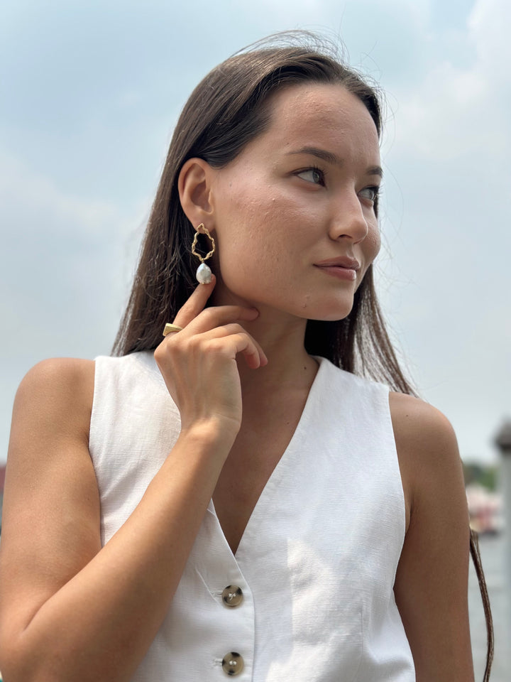 model wears Pearl Gold Branch Drop Earrings