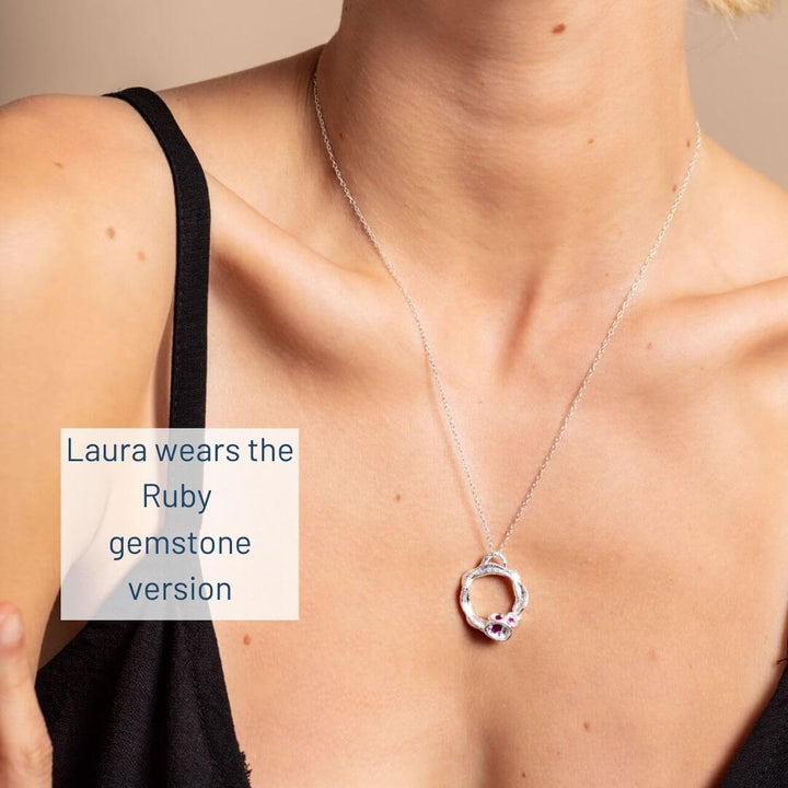 Laura wears large ruby silver version