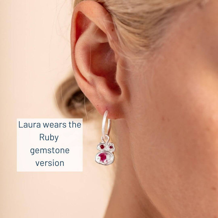 Laura wears Ruby gemstone silver earrings