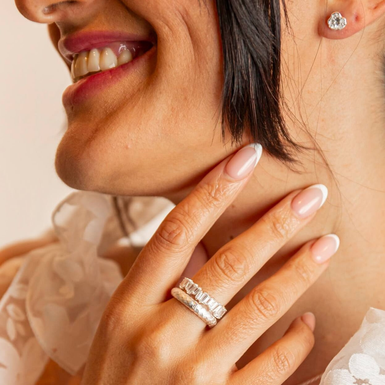 model wears  Lab grown diamond and silver art deco statement ring and silver sparkly eternity ring
