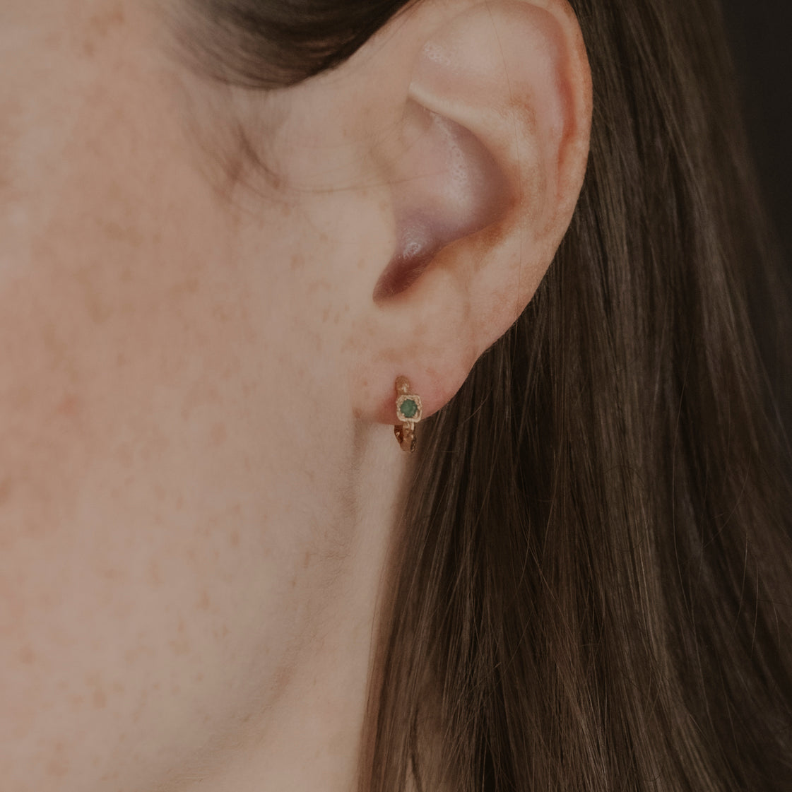 model wears Chalcedony Lichen Branch Gold Huggies