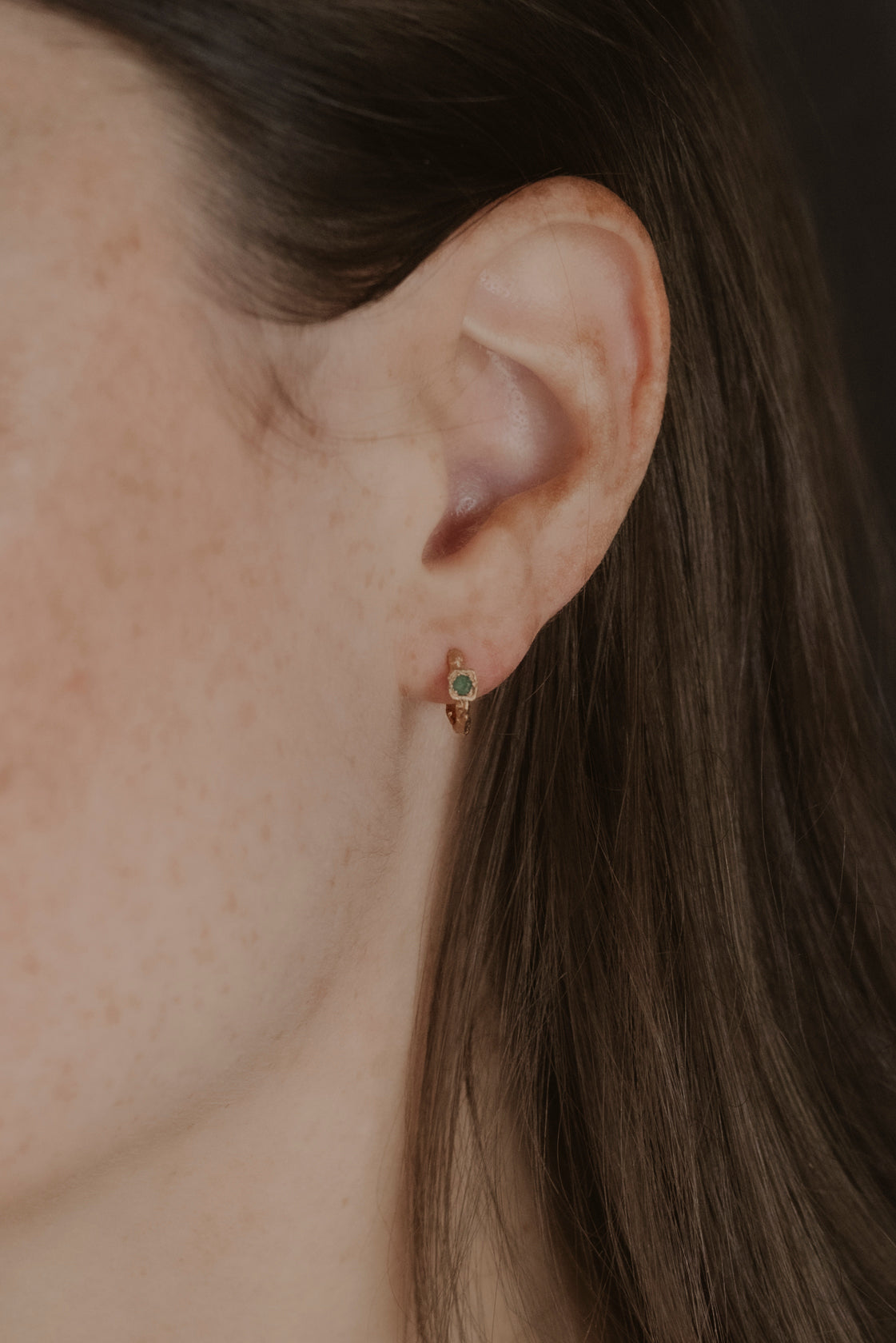 model wears Chalcedony Lichen Branch Gold Huggies