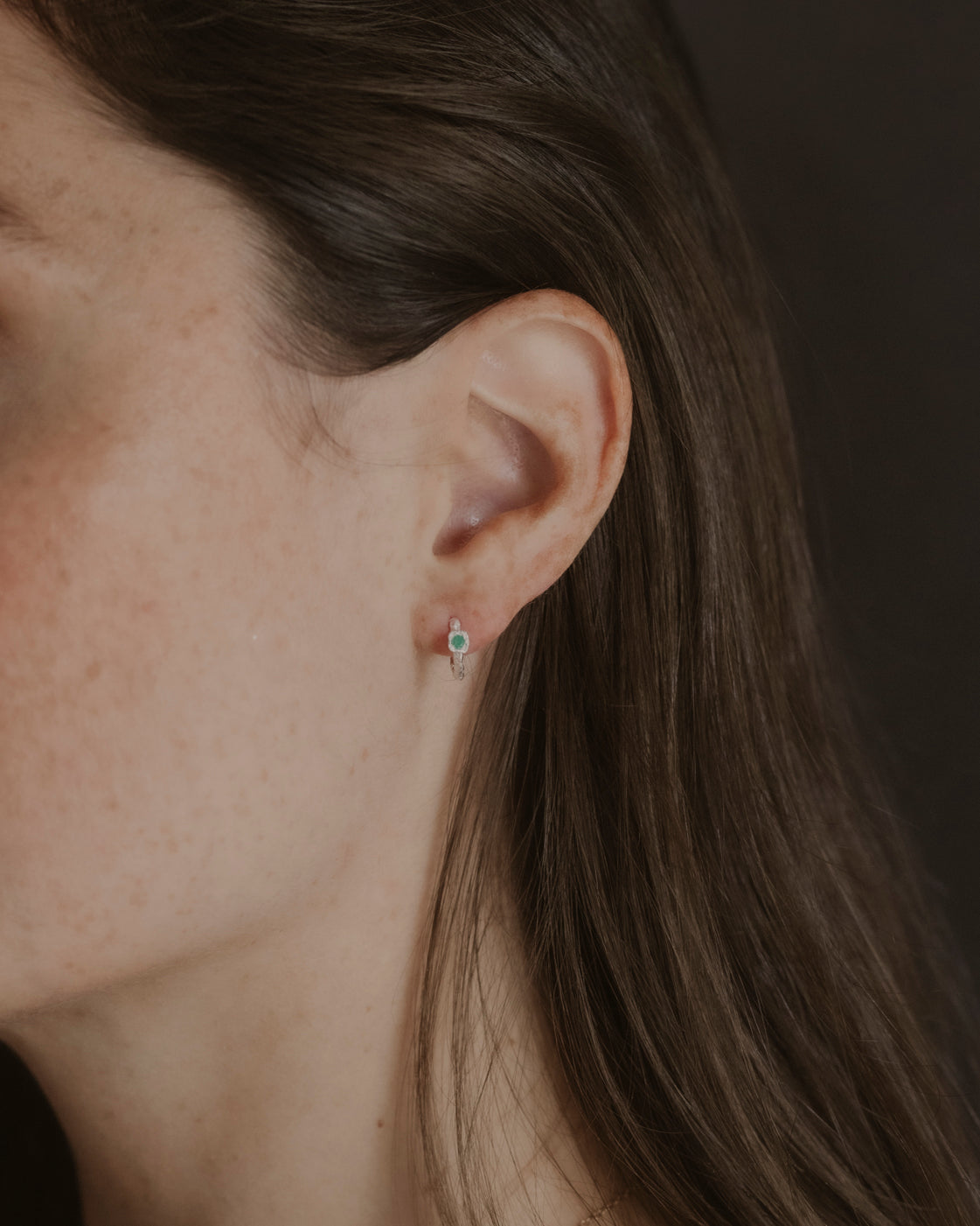 model wears Chalcedony Lichen Branch Silver Huggies