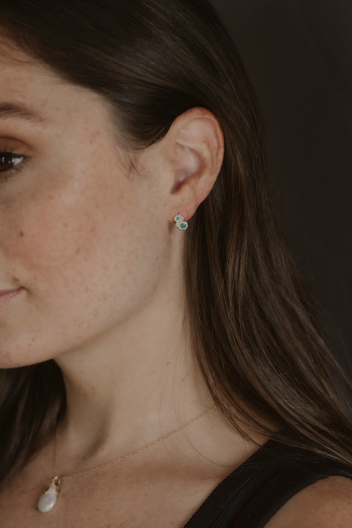 model wears Chalcedony Twisted Branch Silver Huggies
