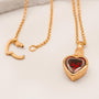 Garnet Heart in Hand Gold Charm Necklace