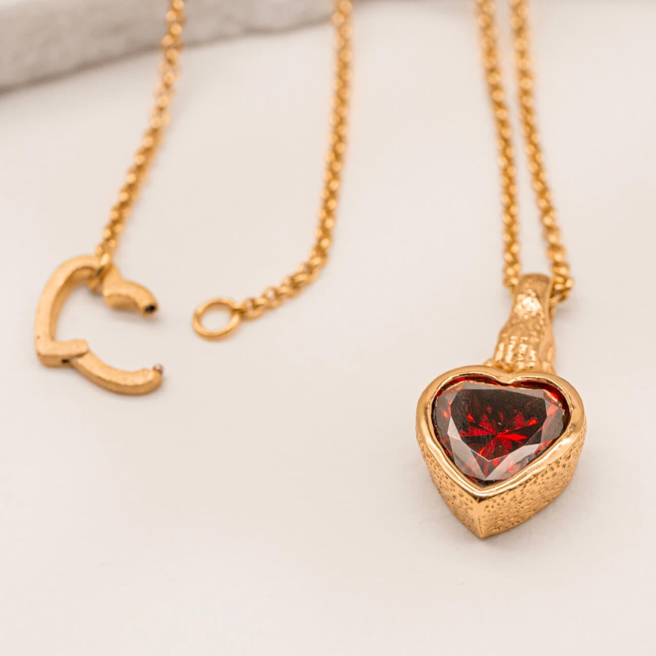 Garnet Heart in Hand Gold Charm Necklace