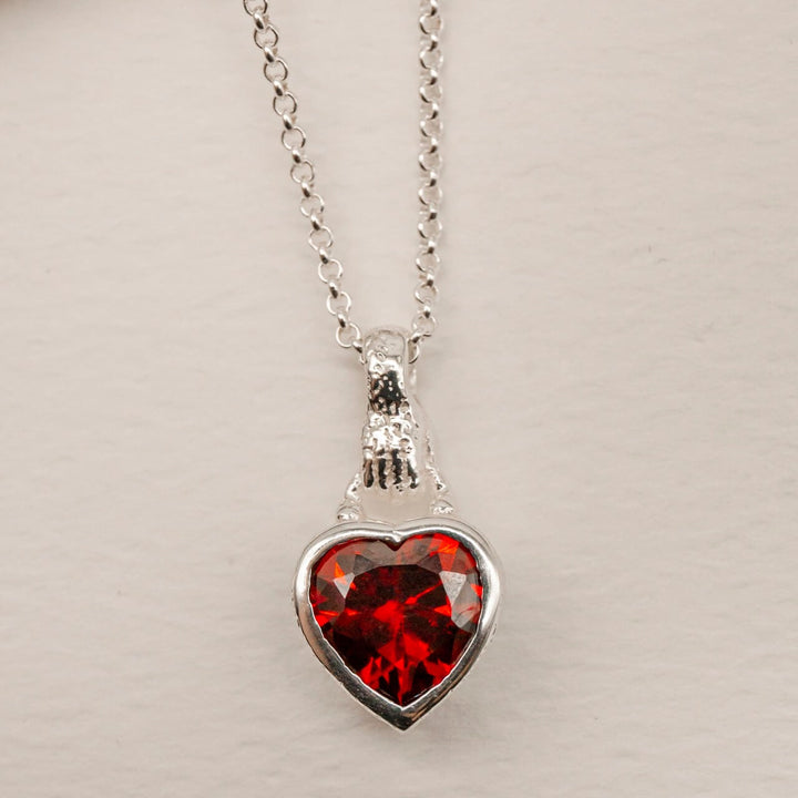 Garnet Heart in Hand Silver Charm Necklace
