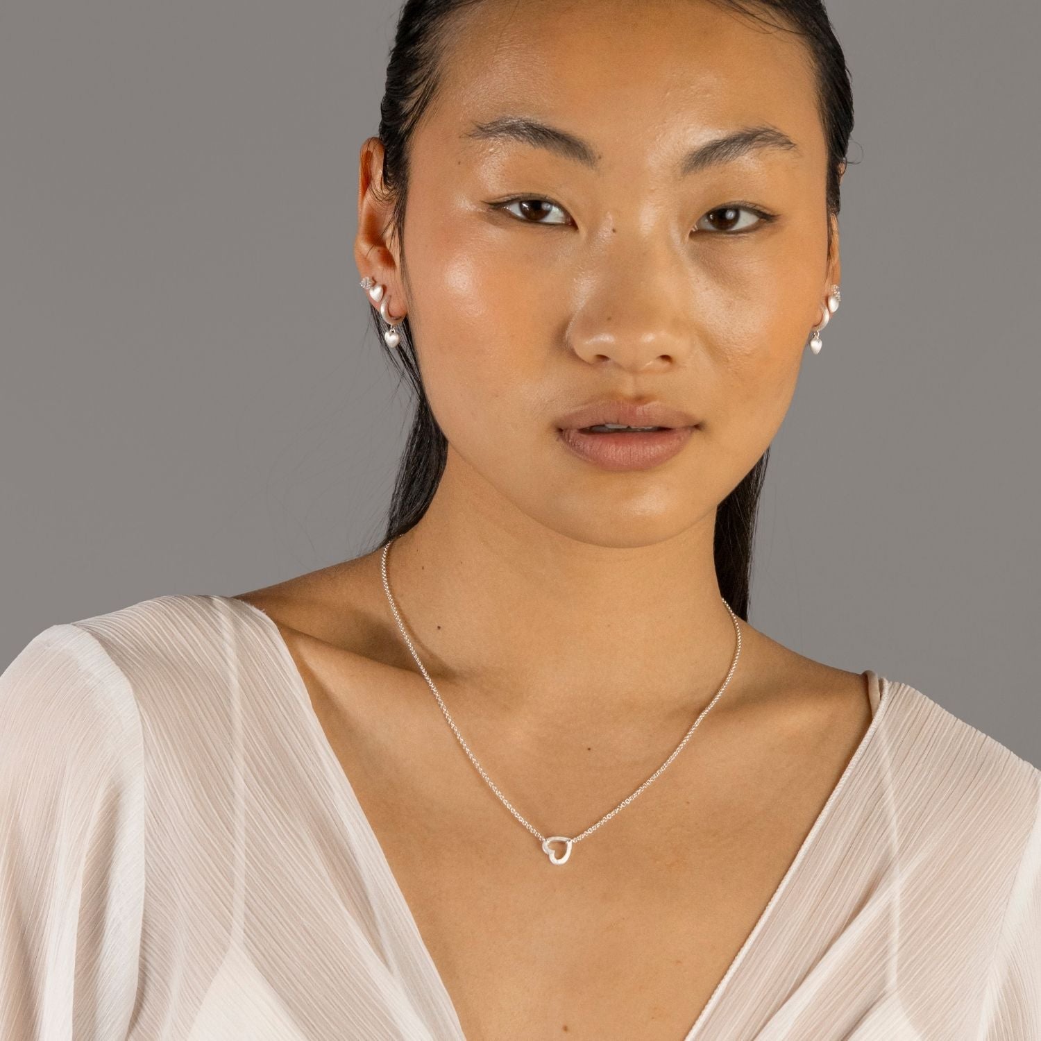 model wears Brushed Heart Silver Connector Necklace