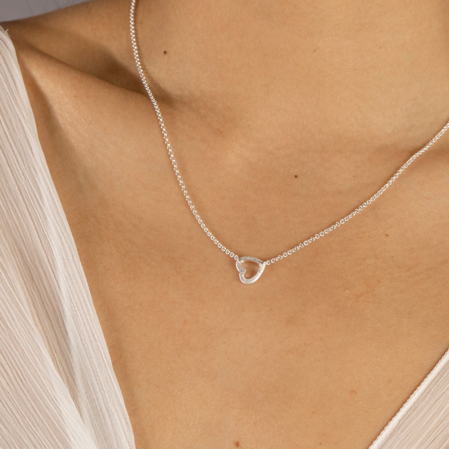 model wears Brushed Heart Silver Connector Necklace
