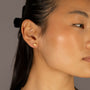Jade wears Brushed Heart Gold Stud Earrings