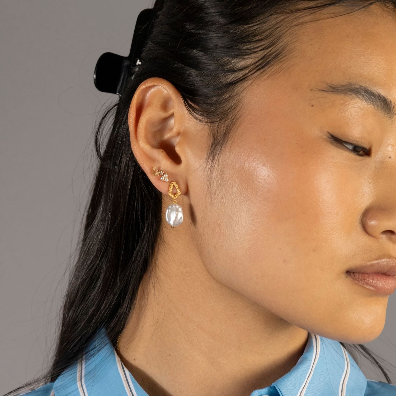 model wears Loved Gold Shorthand Stud Earring
