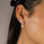 Jade wears Brushed Heart Silver Huggie Hoops